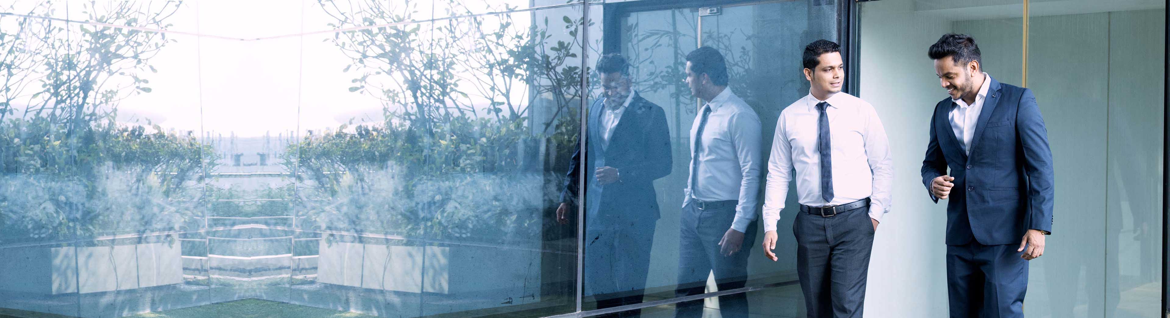 Two business men walking in the office